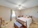 Sunlit bedroom featuring neutral walls, a comfortable bed and window with curtains at 2615 High Ridge Church Rd, Marshville, NC 28103