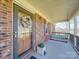 Inviting front porch with a porch swing and decorative wreath, perfect for relaxing outdoors at 2615 High Ridge Church Rd, Marshville, NC 28103