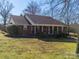 Charming brick home with a covered porch, set in a well-maintained yard with mature trees at 2615 High Ridge Church Rd, Marshville, NC 28103