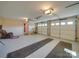 Two car garage featuring two garage doors, pull down lights and carpeted runners at 2615 High Ridge Church Rd, Marshville, NC 28103