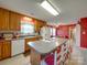 Large kitchen with bright cabinets and access to dining area. Island with seating for entertaining at 2615 High Ridge Church Rd, Marshville, NC 28103
