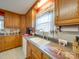 Bright kitchen featuring ample counter space, classic cabinetry, and a double sink at 2615 High Ridge Church Rd, Marshville, NC 28103