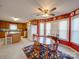 Spacious kitchen with wood cabinets, a center island cooktop, and an adjacent breakfast area with red walls at 2615 High Ridge Church Rd, Marshville, NC 28103