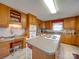 Well-equipped kitchen with ample cabinet space, a functional center island, and a built-in workstation at 2615 High Ridge Church Rd, Marshville, NC 28103
