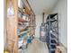Storage room with wooden and metal shelving stocked with various storage containers and hot water tank at 2615 High Ridge Church Rd, Marshville, NC 28103