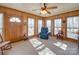 Cozy sunroom features plenty of natural light with a comfortable chair and charming decor at 2615 High Ridge Church Rd, Marshville, NC 28103