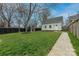 Beautiful backyard with paver walkway, playhouse, storage house and green space at 304 W Park Ave, Charlotte, NC 28203