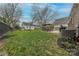 Large, green backyard with a patio, a playhouse and a detached garage at 304 W Park Ave, Charlotte, NC 28203