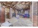 Unfinished basement with exposed insulation, brick supports and concrete floor awaiting personalization at 304 W Park Ave, Charlotte, NC 28203