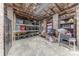 Unfinished basement offers storage space with shelving units against brick walls at 304 W Park Ave, Charlotte, NC 28203