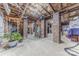 Unfinished basement with exposed beams, utilities, and brick columns at 304 W Park Ave, Charlotte, NC 28203