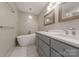 Elegant bathroom featuring double sinks, and a modern soaking tub, and updated fixtures at 304 W Park Ave, Charlotte, NC 28203