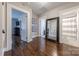 Hallway leads to bathroom and bedroom, features hardwood floors at 304 W Park Ave, Charlotte, NC 28203