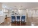 Spacious open kitchen with island, seating, white cabinets, and stainless appliances at 304 W Park Ave, Charlotte, NC 28203