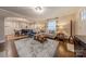 Open concept living room showcasing hardwood floors and view into dining area at 304 W Park Ave, Charlotte, NC 28203