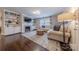 Comfortable living room with built-in shelves and ample seating. Hardwood floors at 304 W Park Ave, Charlotte, NC 28203