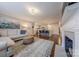 Spacious living room open to kitchen features hardwood floors and a fireplace at 304 W Park Ave, Charlotte, NC 28203