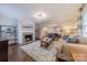 Cozy living room with fireplace, hardwood floors and view into dining area at 304 W Park Ave, Charlotte, NC 28203