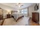 Cozy bedroom with neutral walls, hardwood floors, and a ceiling fan at 304 W Park Ave, Charlotte, NC 28203