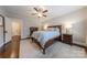 Bedroom features neutral walls, hardwood floors, a ceiling fan, and ample space at 304 W Park Ave, Charlotte, NC 28203
