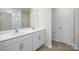 Modern bathroom showcasing double vanity, white cabinets, and tile flooring at 3164 Ora Smith Rd, Lincolnton, NC 28092