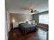 Minimalist bedroom features hardwood floors, a ceiling fan, and two bedside tables at 321 Creek Se Trl, Concord, NC 28025