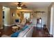 Inviting living room featuring hardwood floors and natural light, seamlessly connecting to the dining area at 321 Creek Se Trl, Concord, NC 28025