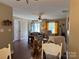 Open-concept space showcasing the dining area and living room with hardwood floors and natural light at 321 Creek Se Trl, Concord, NC 28025