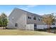 A fenced backyard features light siding and multiple windows at 3230 Yarmouth Ln, Gastonia, NC 28056