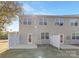 A fenced backyard features light siding, multiple windows, and access doors to the home at 3230 Yarmouth Ln, Gastonia, NC 28056