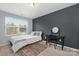 Cozy bedroom with a large window for natural light, full-size bed, and vanity with mirror at 3230 Yarmouth Ln, Gastonia, NC 28056