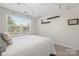 Serene bedroom with carpet, shelves for decor, a window, and a full-size bed at 3230 Yarmouth Ln, Gastonia, NC 28056