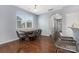 Inviting dining room with hardwood floors that connect to the kitchen bar seating area at 3230 Yarmouth Ln, Gastonia, NC 28056