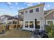 Back of house features a two-story deck, large picture windows and a well manicured yard at 343 Belton St, Charlotte, NC 28209