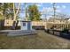 Well-maintained backyard featuring a shed, built-in grill, and fenced perimeter for privacy at 343 Belton St, Charlotte, NC 28209