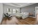 Bright bedroom with hardwood floors, a large window and a seating area at 343 Belton St, Charlotte, NC 28209