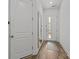 Bright entryway featuring wood floors, white doors, and a stylish mirror at 343 Belton St, Charlotte, NC 28209