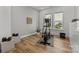 Well-lit exercise room with wood floors, modern equipment, and a serene atmosphere at 343 Belton St, Charlotte, NC 28209
