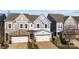 Charming townhome showcasing a stone accented two-car garage and neutral color palette at 343 Belton St, Charlotte, NC 28209