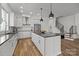 Bright, modern kitchen with white cabinets, stainless steel appliances, and an island with pendant lighting at 343 Belton St, Charlotte, NC 28209