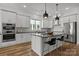 Bright kitchen with modern appliances, a central island, and stylish pendant lighting at 343 Belton St, Charlotte, NC 28209
