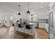 Modern kitchen with stainless steel appliances, sleek island, and ample cabinet space at 343 Belton St, Charlotte, NC 28209