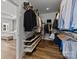 Well-organized walk-in closet with shelves, hanging rods, and a view into the bedroom at 343 Belton St, Charlotte, NC 28209