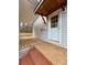 Home's back entrance boasts of brick steps and concrete platform, offering access to a quaint backyard at 3437 Wilkesboro Hwy, Statesville, NC 28625