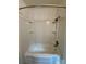 Classic bathtub and shower featuring built-in shelves and shower head at 3437 Wilkesboro Hwy, Statesville, NC 28625