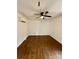 Bedroom featuring ceiling fan, hardwood floors, white walls, and air conditioner at 3437 Wilkesboro Hwy, Statesville, NC 28625