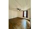 Spacious bedroom featuring dark hardwood floors, a ceiling fan, and bright natural light at 3437 Wilkesboro Hwy, Statesville, NC 28625