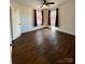 Bright bedroom with hardwood flooring, a ceiling fan, and natural light from the window at 3437 Wilkesboro Hwy, Statesville, NC 28625