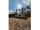 Quaint single-story home with light gray siding, mature trees, and a lush natural landscape at 3437 Wilkesboro Hwy, Statesville, NC 28625