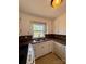 Efficient kitchen featuring white cabinets, tile countertops, and modern appliances, offering a practical cooking space at 3437 Wilkesboro Hwy, Statesville, NC 28625